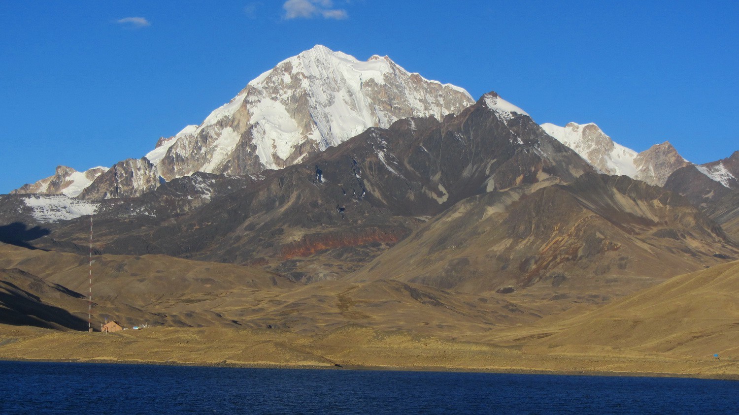 Laguna Tuni with Huayna Potosi, Maria Lloco and the house of the caretaker of the water for La Paz (down left corner)